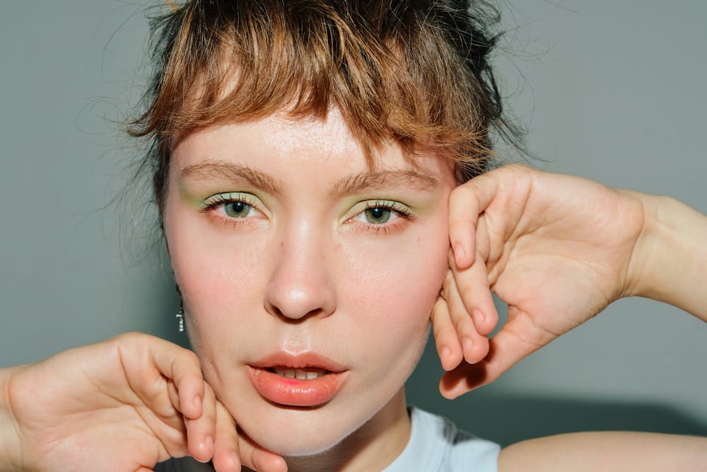 Young women with green eyeshadow