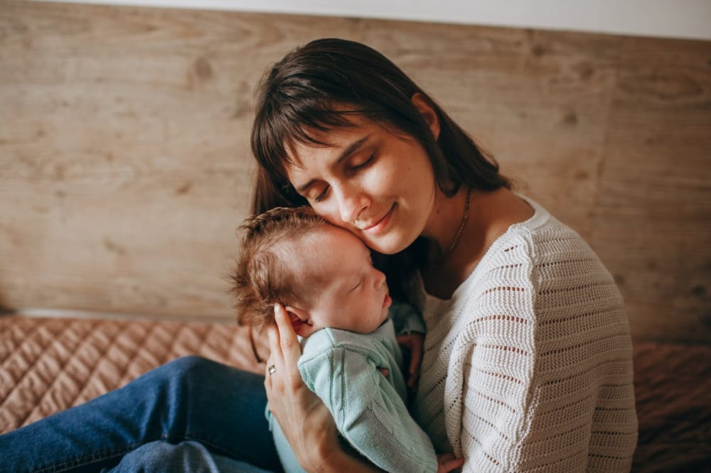 Mother holding her newborn baby