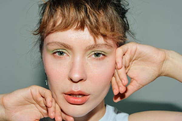 Young women with green eyeshadow