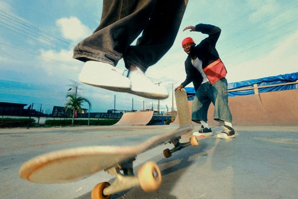 Two skaters performing tricks
